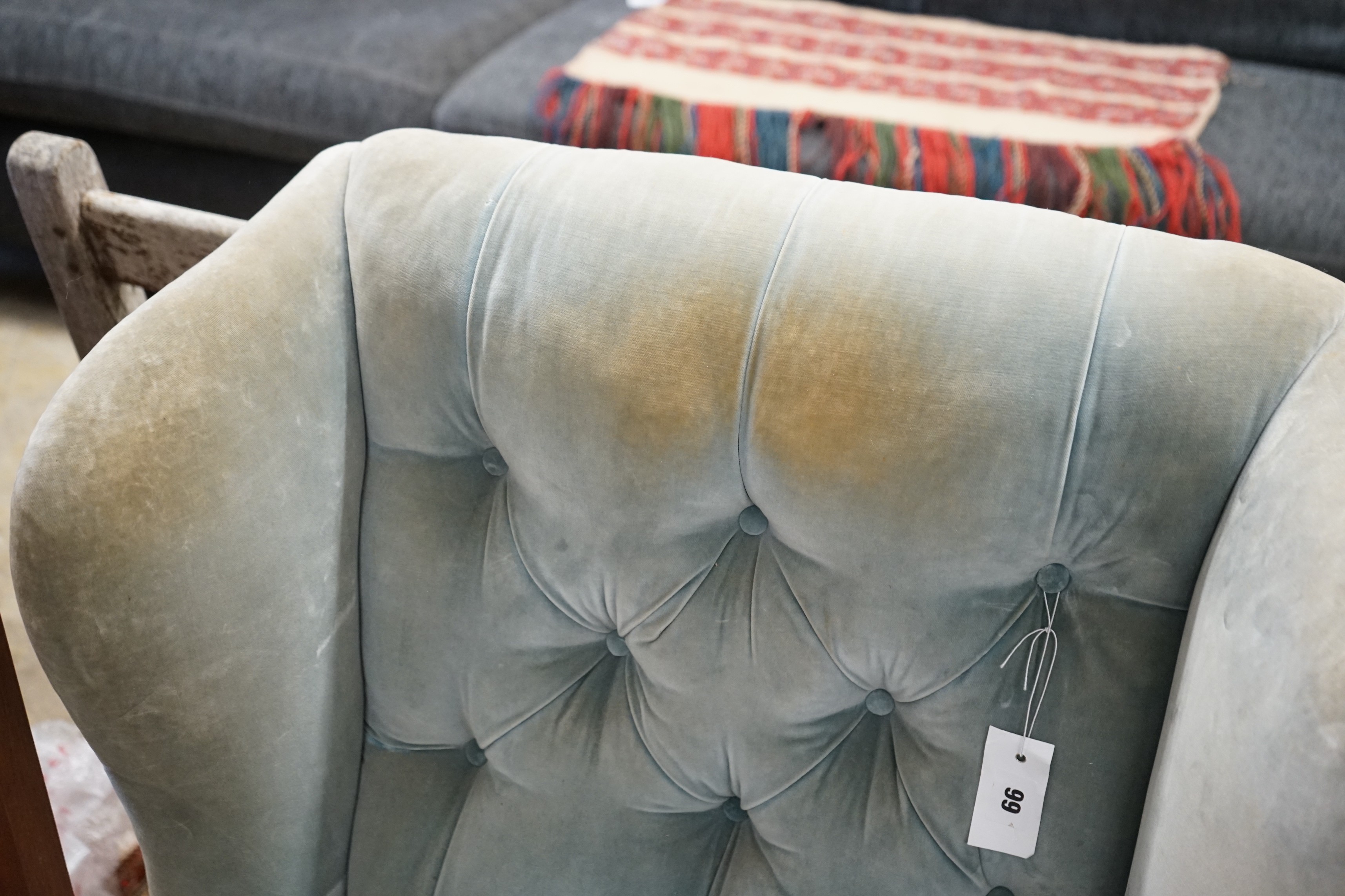 A late Victorian upholstered wing armchair, width 76cm, depth 82cm, height 90cm
